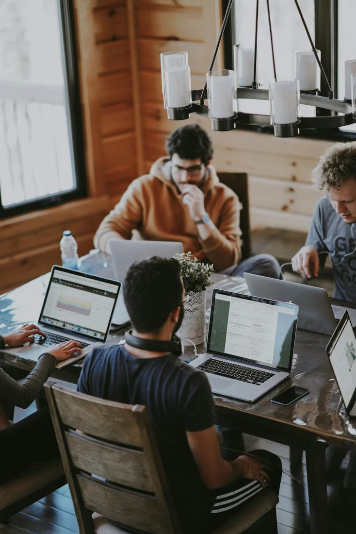 People reviewing work together at a table