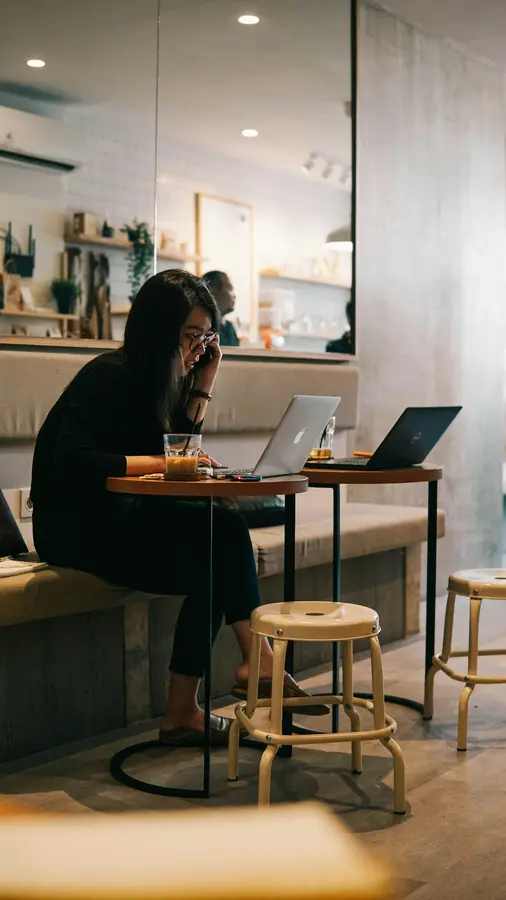 A person working on a laptop at a café in South Jakarta